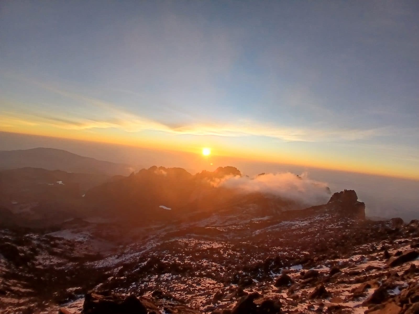 Sunrise over a sea of clouds seen from high on Mount Kenya