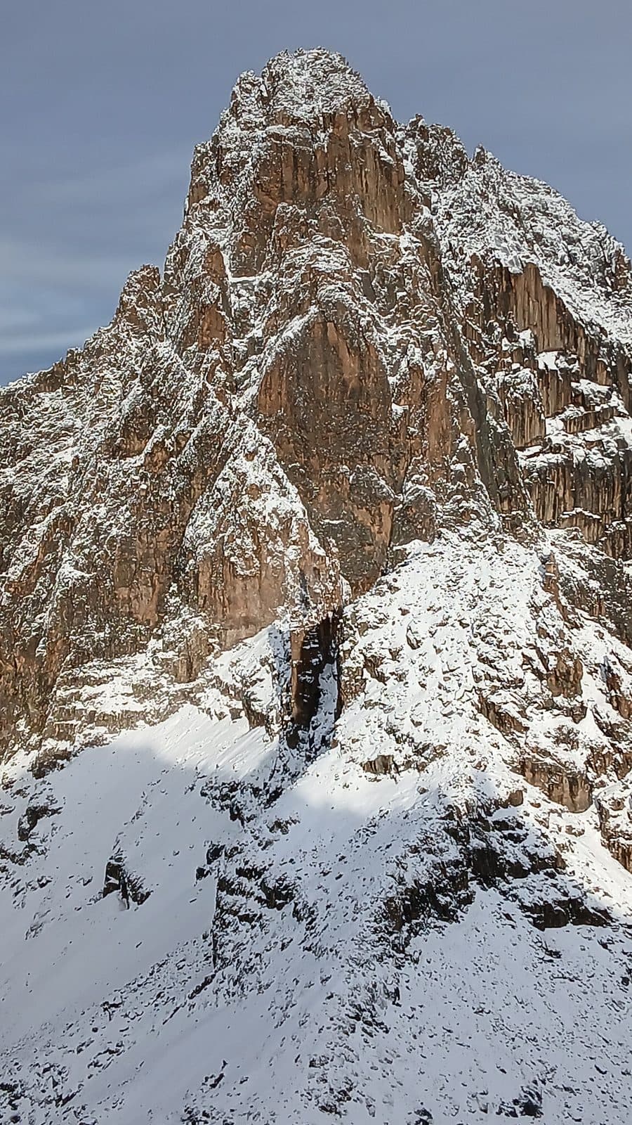 Batian and Nelion peaks of Mount Kenya dusted with fresh snow