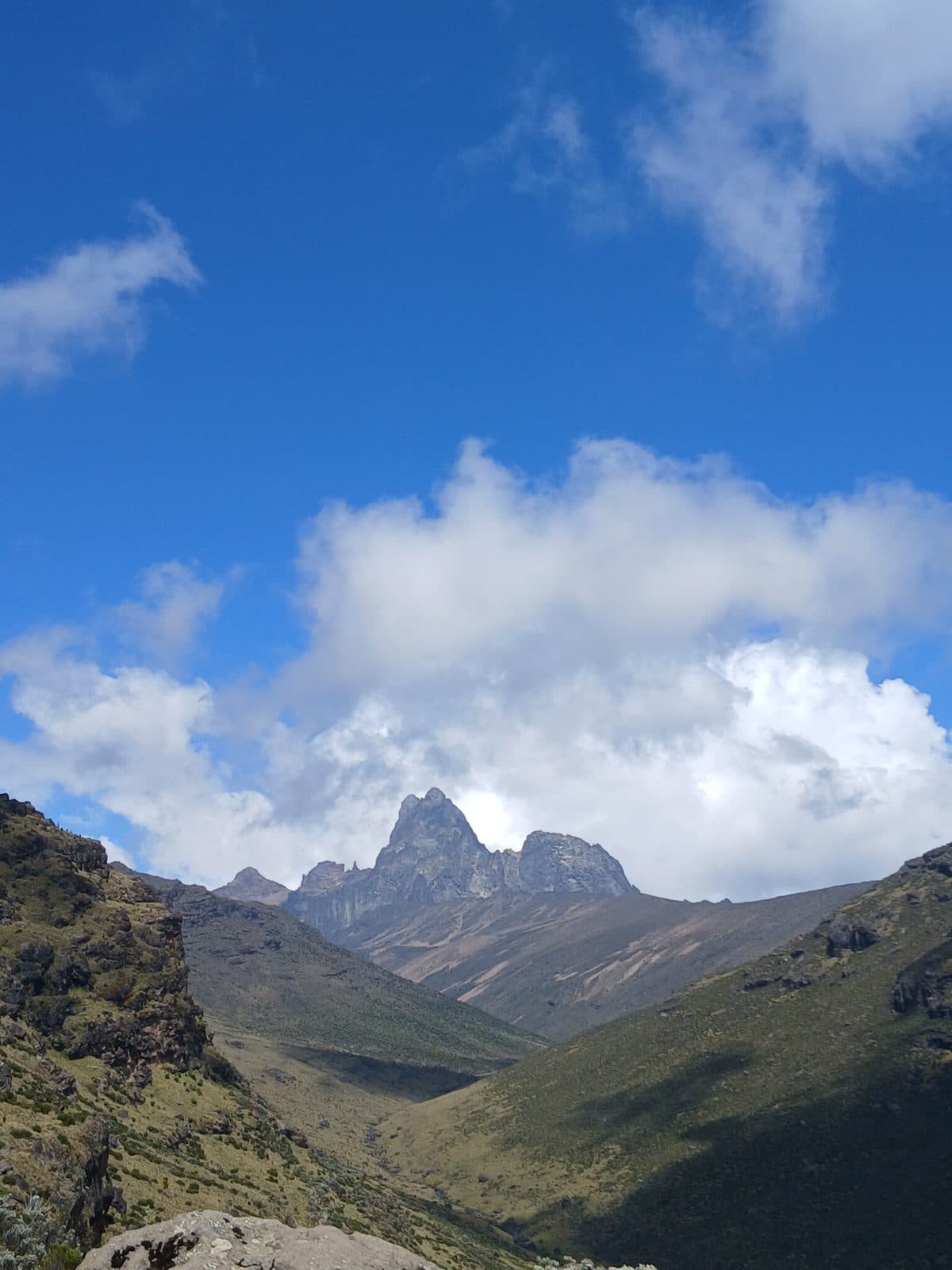 Mount Kenya's peaks at the end of a long green valley